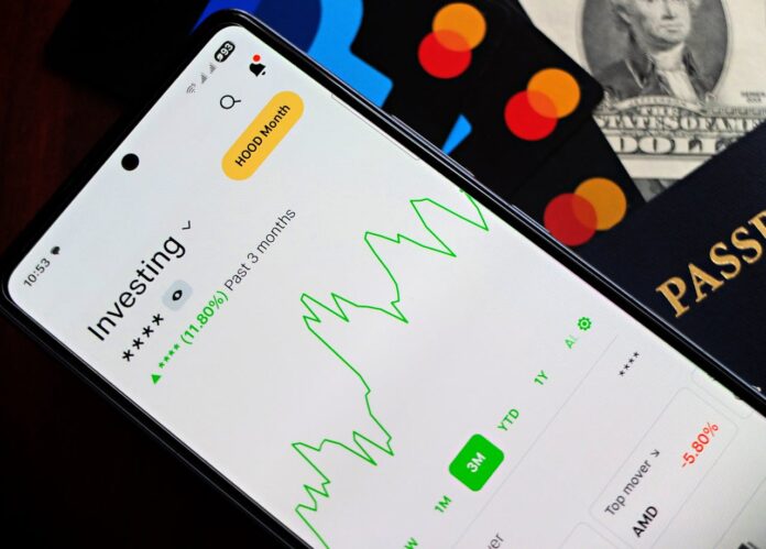 Mobile screen displaying an investment app with a stock market graph